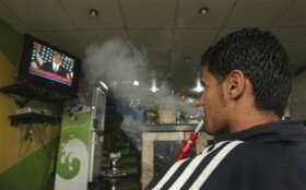A Libyan watches a television broadcast of a speech by President Barack Obama in U.S., at a shop in Benghazi May 19, 2011. Credit: REUTERS/Mohammed Salem